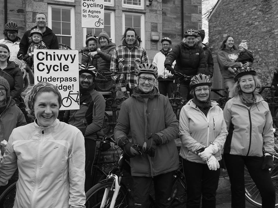 Group of cyclists holding placards