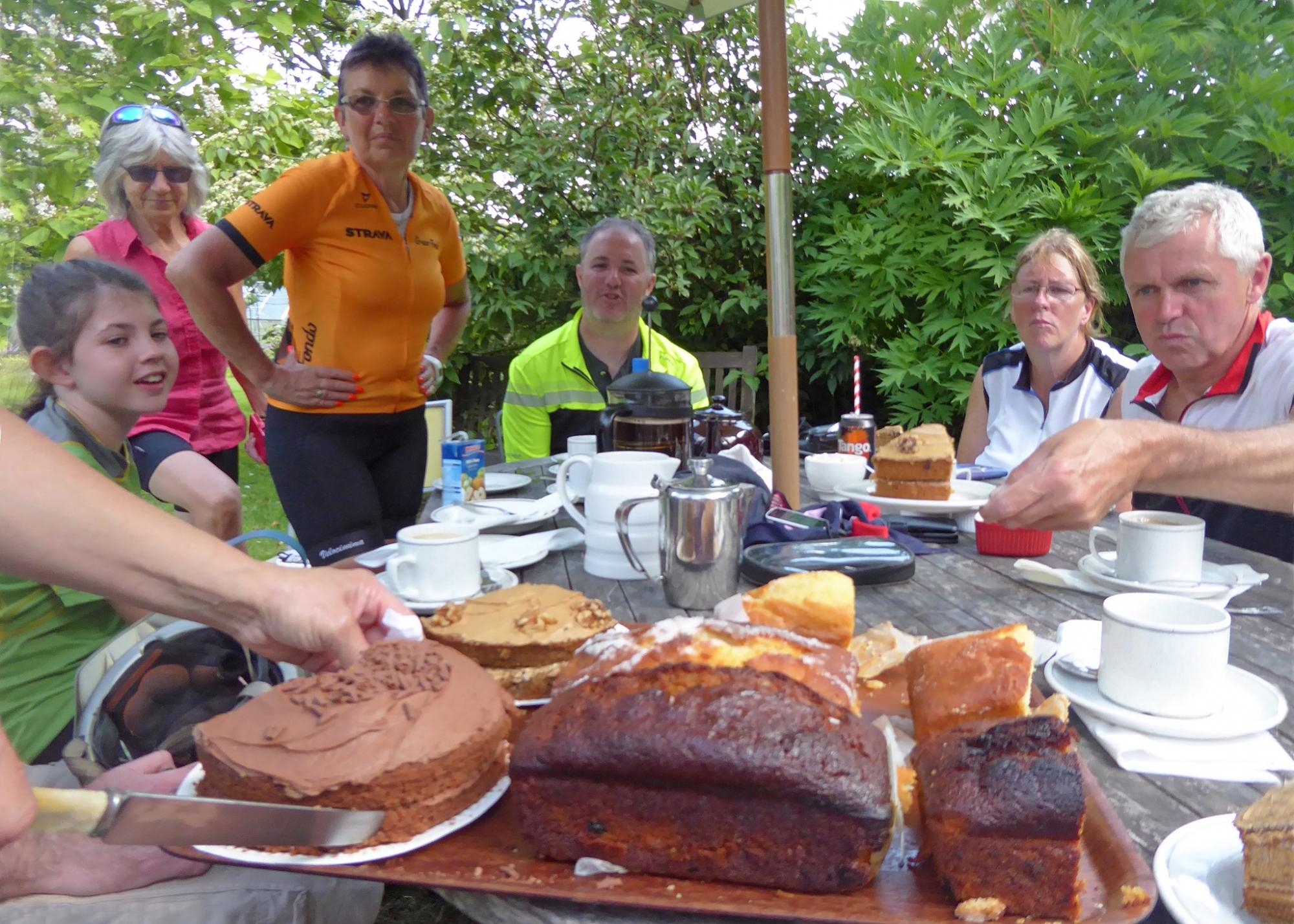 Cyclists eating cake at Annie's