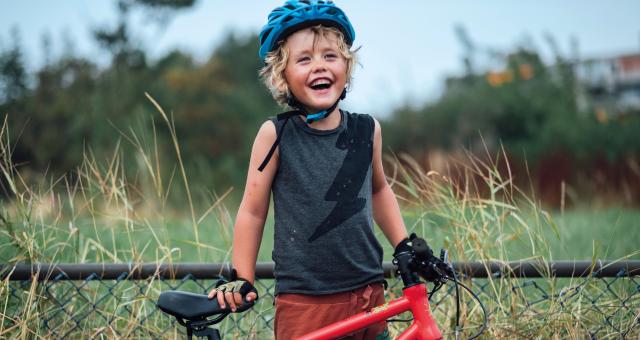 Boy next to his bike