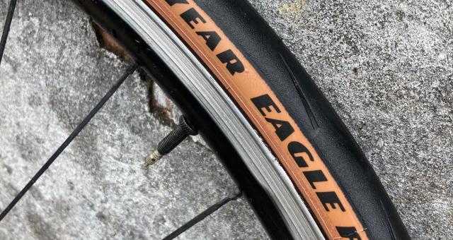 A section of a bike wheel showing the Goodyear Eagle F1 tyre