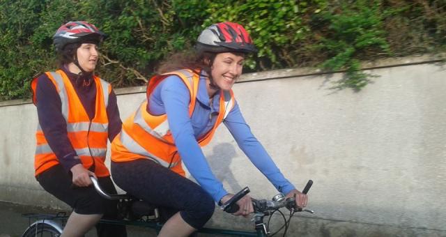 Charlotte riding with her family