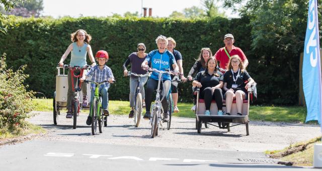 Participants riding a variety of bikes and trikes at the WheelNess project launch in Inverness