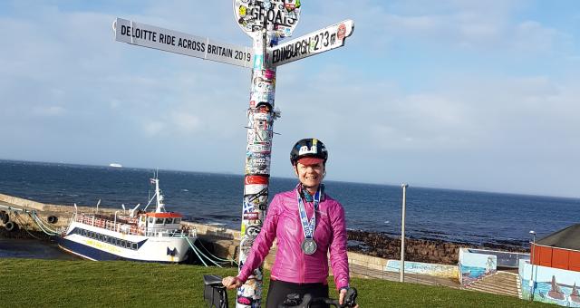 Laura Laker with her bike at John o' Groats