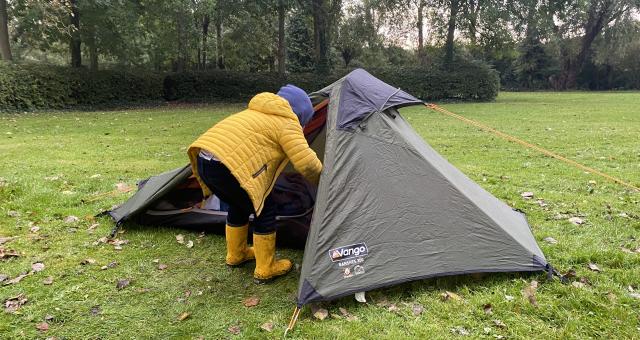 little boy looking inside a small tent