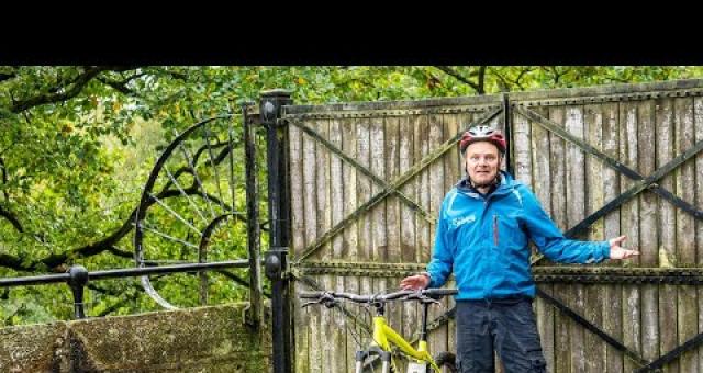 A cyclist standing in front of blocked access