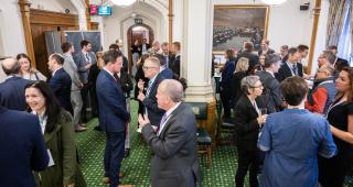 A large number of people having conversations at the Create Streets report launch event at Westminster (c) Benjamin Mole